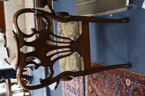 A pair of George I style walnut elbow chairs